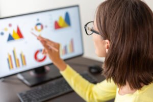 Digital marketing professional analyzing campaign performance and business data.